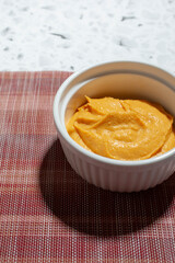 A view of a bowl of sweet potato dip.