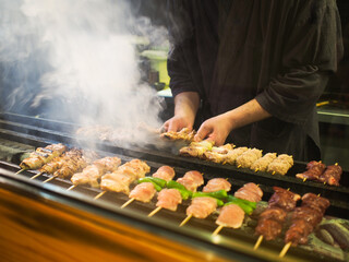 Chef preparing food in Japanese Yakitori restaurant