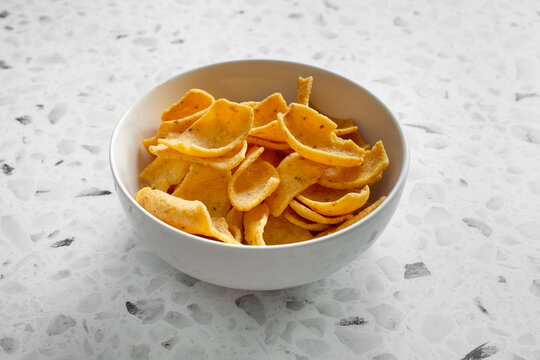 A view of a bowl of corn chips.