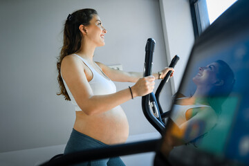 Pregnant woman at the gym.