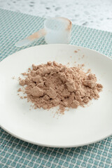 A view of a pile of chocolate protein powder.
