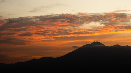 Glowing Horizon Over Mountain Ranges at Sunrise