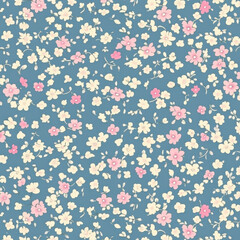 Obraz premium small scattered flowers pattern, blue background, pink and cream colored tiny floral design
