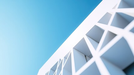Obraz premium A white building with a clear blue sky in the background, ideal for use in architectural or design-related projects