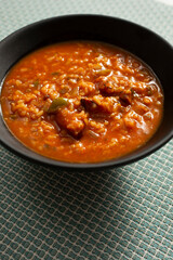 A view of a bowl of jambalaya soup.