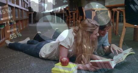 Image of diagrams and data processing over caucasian students learning in library