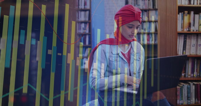 Image of diagrams over biracial female student using laptop