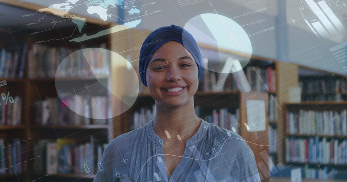 Image of diagrams and data processing over biracial female student smiling