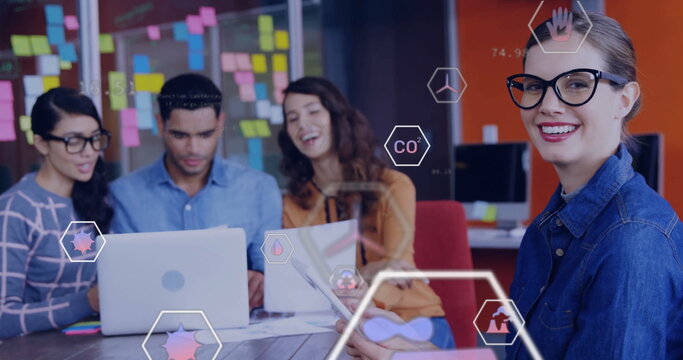 Image of eco icons and data processing over diverse business people in office