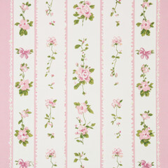 A pattern of small roses and bows in pink and green on a white, printed fabric with long strips of fabric. The background is pink, with a white border around the edge of each strip of material. 