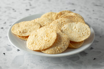A view of a pile of papadam chips.