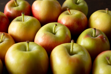 A view of a pile of crimson gold apples.