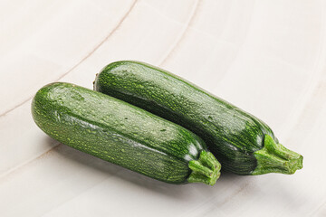 Raw green ripe zucchini vegetable