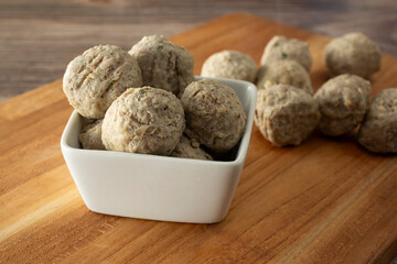 A view of a bowl of chicken meatballs.