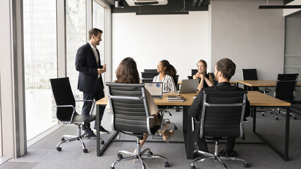 Strategic meetings, negotiations, briefings event. Businesspeople gathered at conference table for...