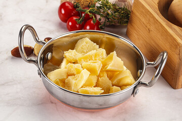 Crushed parmesan cheese in the bowl