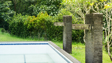 Fototapeta premium Outdoor Swimming Pool with Stone Water Features
