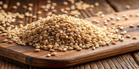 Obraz premium A Bountiful Heap of Creamy-Colored Seeds Resting on a Rustic Wooden Board