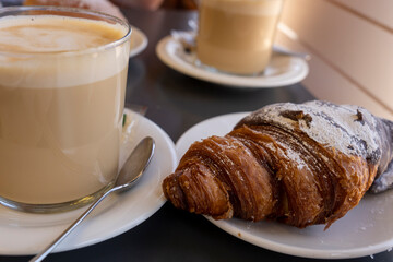 Fresh croissant on table breakfast table in cafe Spain