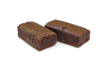 Pieces of fresh brownie on white background. Delicious chocolate pie