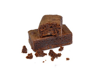 Pieces of fresh brownie on white background. Delicious chocolate pie