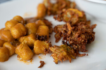 Fried onion and calamari on plate