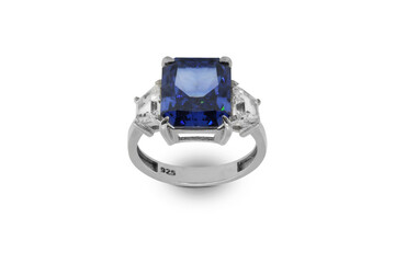 A closeup of a sophisticated women's ring featuring a large, brilliant blue stone, accented with...