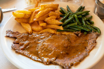 Gressoney valley typical food in restaurant Aosta Italy deer meat in sauce