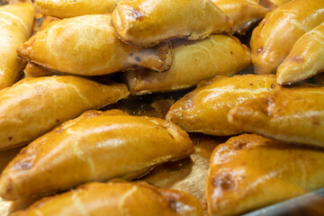 freshly baked empanadas pasties with different fillings for sale Murcia Spain