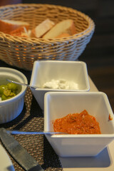 Tomato sauce green olives and Allioli garlic sauce on bowl for spread on bread appetizer from Mediterranean Spain