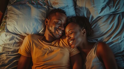 A joyful couple sharing a tender moment while lying on a cozy bed, surrounded by soft pillows in a warm, intimate setting
