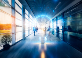 Hong Kong commercial building with blurred figures walking in a modern interior. A glowing lightbulb graphic overlay symbolizes business idea.