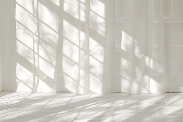 Empty white room with window and sunlight