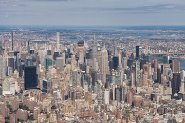 Naklejka premium Manhattan skyline aerial view with iconic skyscrapers, New York City, USA, daytime.