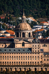 Obraz premium Majestic Royal Monastery of El Escorial stands proudly amidst the scenic Spanish landscape.