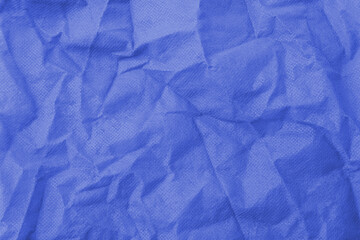 Abstract wrinkled blue crumpled fabric texture background	