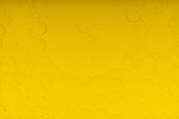 Macro microscope yellow bubble texture, Close-up Yellow bubbles and drops oil background . golden Yellow water bubbles, close up golden oil drop for celebration.