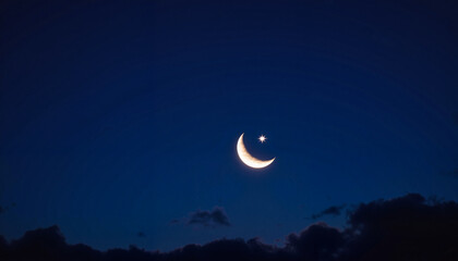 Crescent moon and star glowing in twilight sky, mystical ambiance