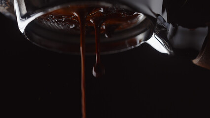 pull espresso shot with bottomless portafilter on a professional coffee machine