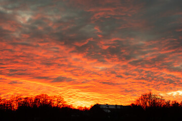 Fototapeta premium Fiery Sunset Over a Rural Horizon