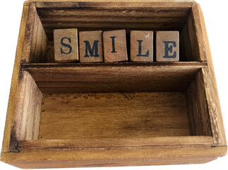 Vintage wooden box with alphabet "Smile"