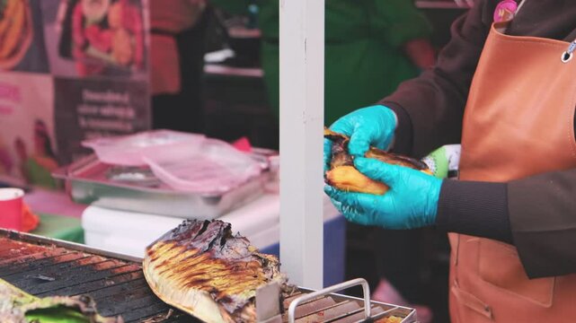 Banana to grill and Skewers of chorizo, cecina is a typical food from the jungle, Peruvian street food.