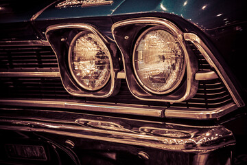 Vintage car headlight - vintage filter effect, retro style.