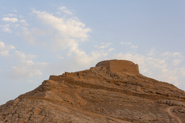 Fototapeta premium Towers of silence are squat circular walled stone structures, inside which bodies of the deceased of Zoroastrians are exposed to birds who eat the flesh. Yazd, Iran.