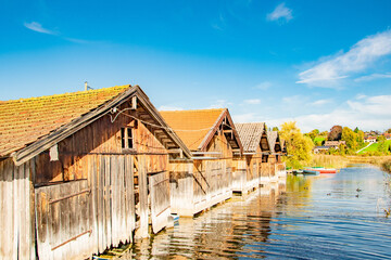 Traditional Wooden Boathouses on a Scenic Lake