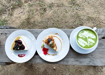 Cheesecake decorated with edible flowers, Matcha latte afternoon tea.