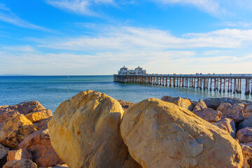 Boulders at Malibu Beach with Pier and Malibu Farm Cafe View © Katie Chizhevskaya