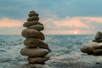 Rocks, Sunset, Beach - Balanced stones on the beach at sunset, symbolizing peace and tranquility.