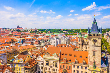 Fototapeta premium A stunning aerial view of the Old Town Hall and Astronomical Clock in Prague, Czech Republic, showcasing its historic architecture, red rooftops, and the beautiful cityscape of this UNESCO-listed town