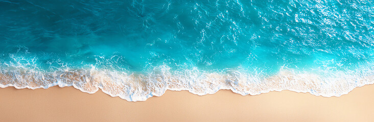 Aerial view of beautiful turquoise sea meeting sandy beach with gentle waves